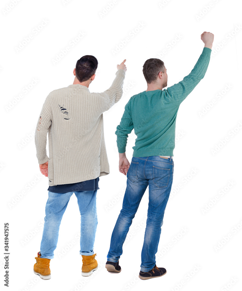 Back view of two man in sweater pointing.