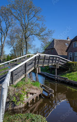 Giethoorn Overijssel Netherlands. During Corona lock-down. Empty streets, paths, bridges and canals. Old farmhouse © A