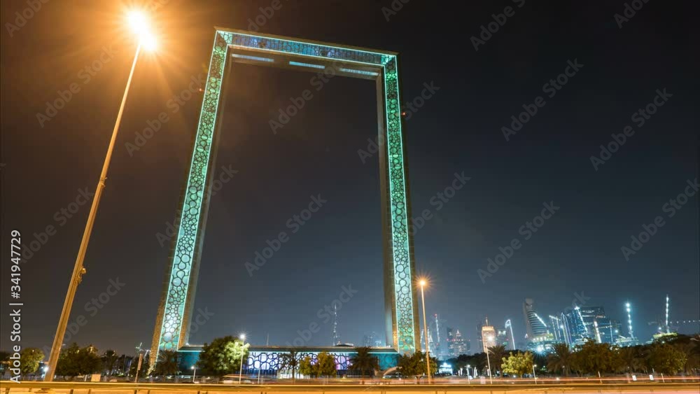 Dubai at night hyperlapse or timelapse, new UAE attraction in Bur Dubai frame building.