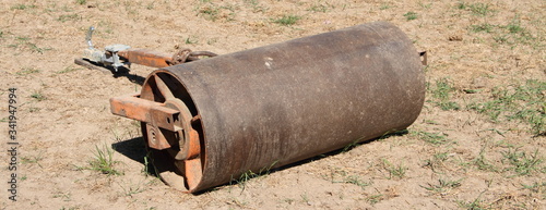 an old roller to compact earth