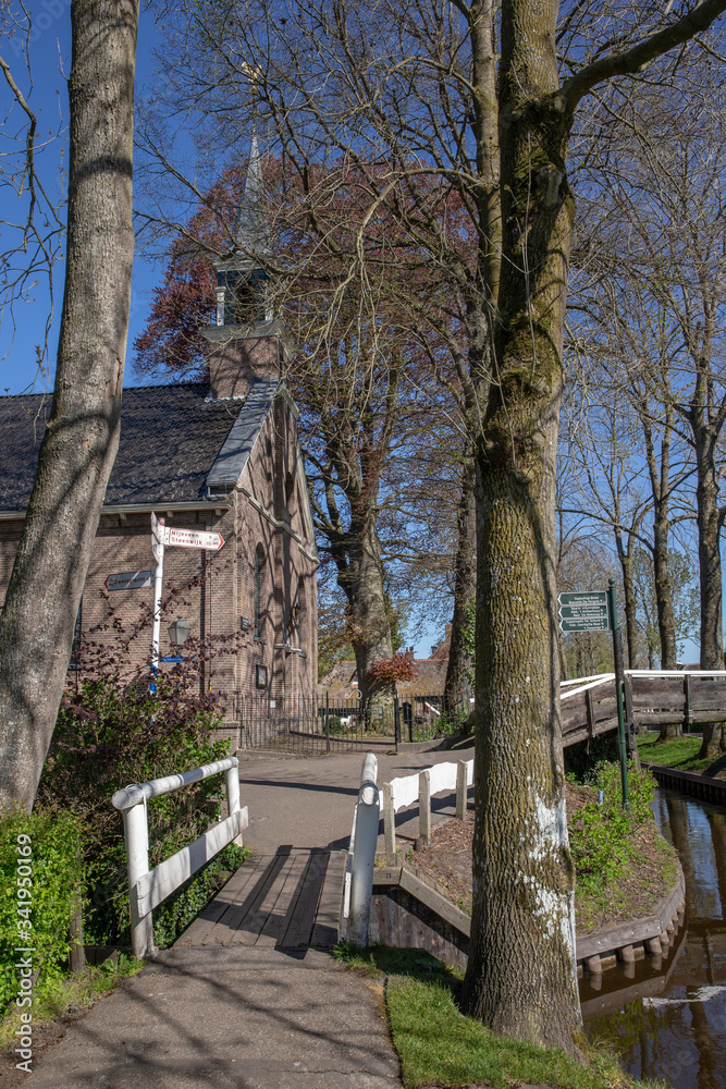 Giethoorn Overijssel Netherlands. During Corona lock-down. Empty streets, paths, bridges and canals. Church
