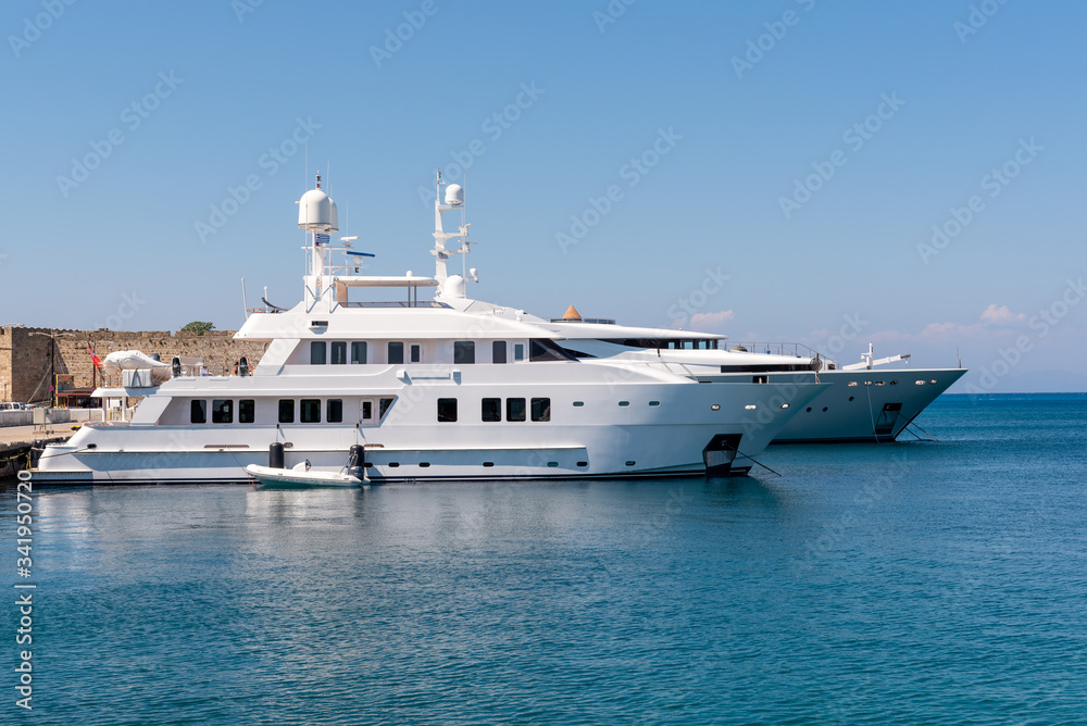 Luxury yachts mooring at the port of Rhodes in Greece