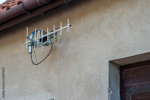 Closeup of a TV antenna mounted on the wall