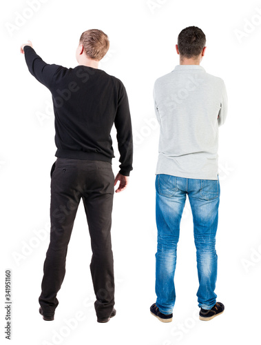 Back view of couple in sweater pointing.