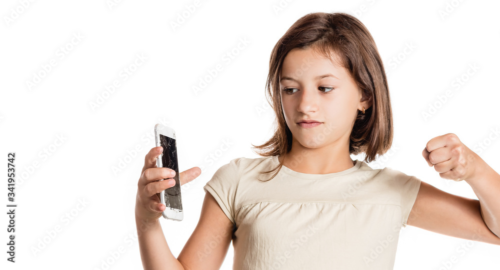 angry little girl holding a smartphone with broken screen angry little girl holding a smartphone with broken screen