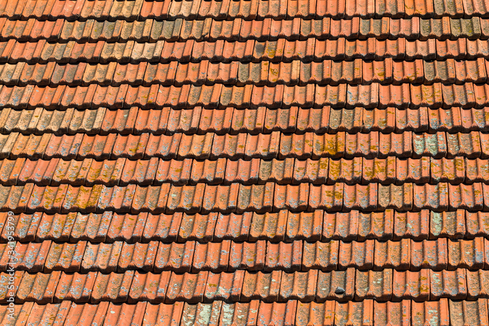 Texture of orange clay roof tiles. Red old dirty roof. Old roof tiles. Construction equipment build a house. Texture of orange clay roof tiles. Red old dirty roof. Old roof tiles. Construction equipment build a house.