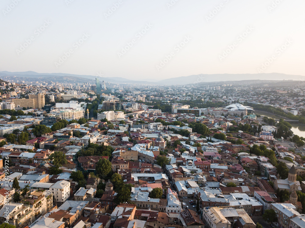 Aerial beautiful panoramic view of Tbilisi old center at sunrise