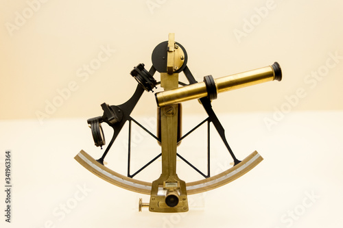 ancient astronomical sextant in gold color