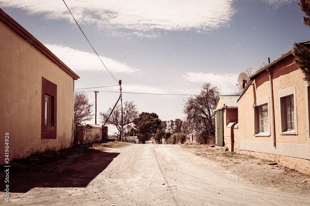 A dirt road running through a small town in rural Karoo region of South Africa A dirt road running through a small town in rural Karoo region of South Africa