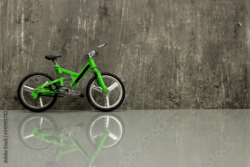 Canvastavla Toy model - full-suspension mountain bike on a gray background, copy space