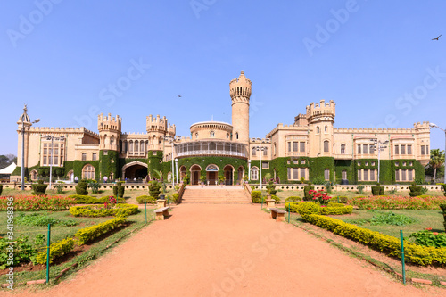 Beautiful exterior view of Bangalore Palace with a garden in front. photo