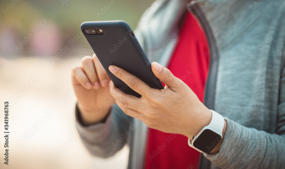 Asian woman using smartphone at city