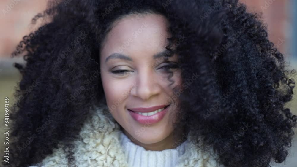 Autumn or winter outdoor portrait of beautiful mixed race young woman Spbi. confident fashionable female looking at camera. happy millennial girl student professional closeup front Autumn or winter outdoor portrait of beautiful mixed race young woman Spbi. confident fashionable female looking at camera. happy millennial girl student professional closeup front