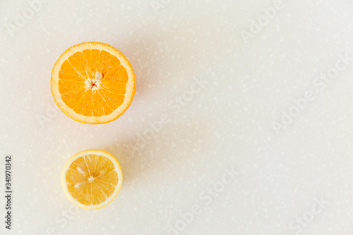 Half of grapefruit  orange  lemon cut for fresh juice. Color splash. Tropical fruits