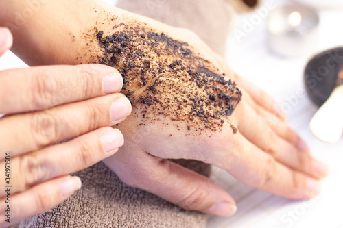 Natural scrub made from coffee and sugar. hand peeling sugar scrub with coffee. spa hand treatment.