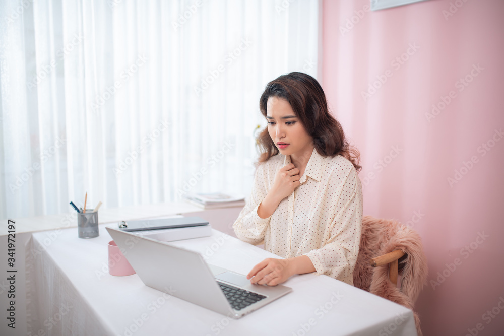 Asian beautiful woman sick with feeling pain in the chest while working with a laptop Asian beautiful woman sick with feeling pain in the chest while working with a laptop