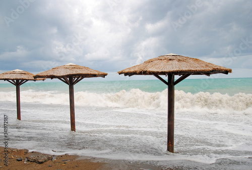 beach umbrellas and sea storm