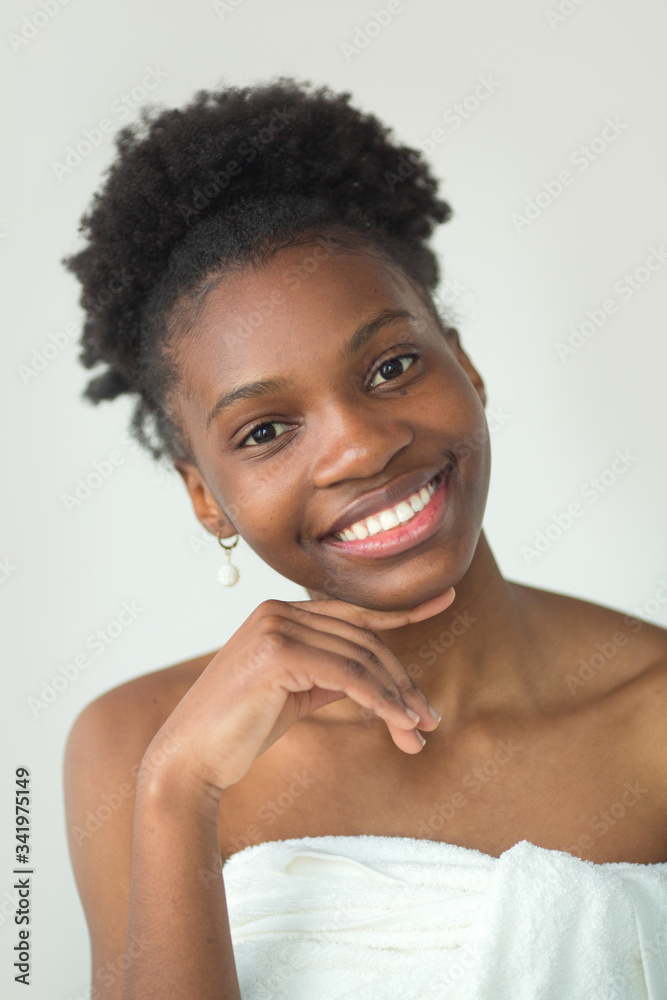 beautiful young african woman in towel on white background beautiful young african woman in towel on white background
