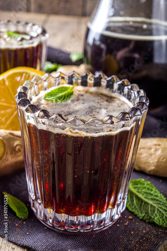Indian summer refreshment beverage, Panakam Or Gur (Jaggery) Sharbat, Panakaam drink, Traditional sarbats, infusions of fruits, flowers, herbs, roots, rustic wooden background copy space