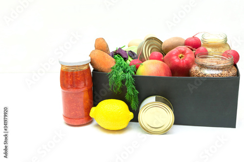 supplies food help box full of vegetables, canned, cereal, eggs and fruits. donation box for delivery charity with copy space. coronavirus volunteer donation isolated on white background