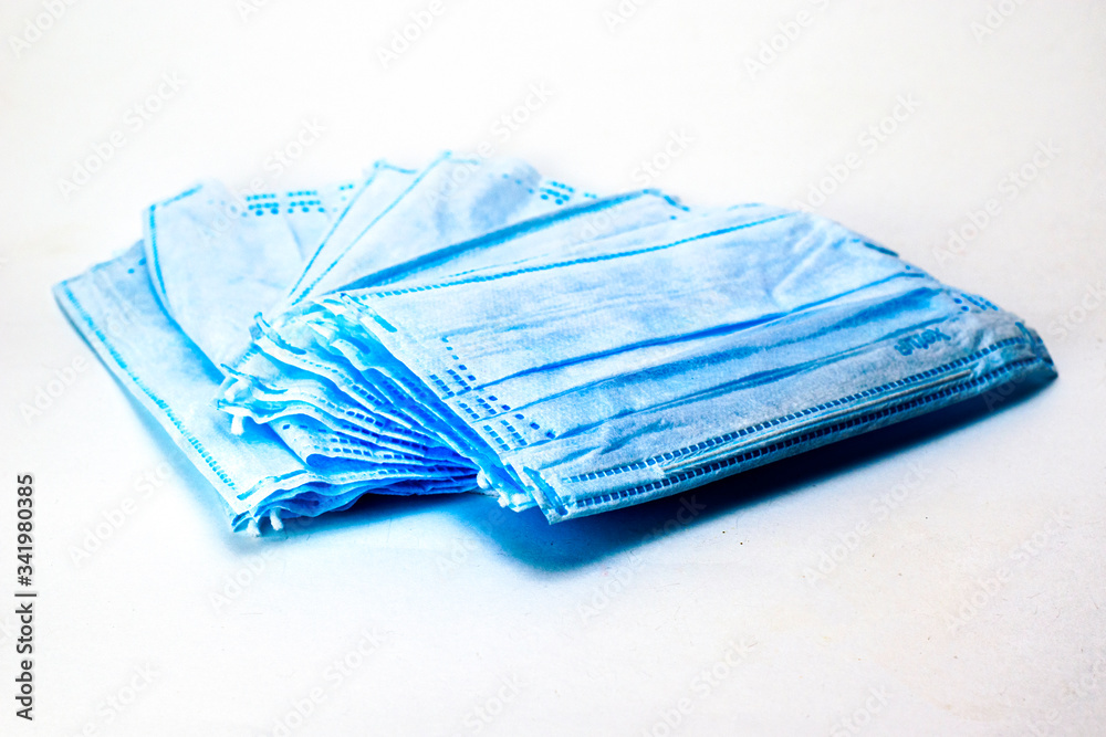 stack of medical hygiene masks on the white background stack of medical hygiene masks on the white background