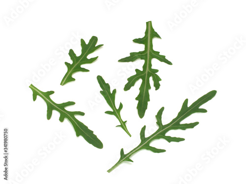 Fresh arugula leaves, top view isolated on a white background