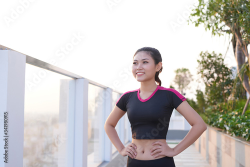 Beautiful young Asian woman standing outdoor and hands touching her belly. Free Download Beautiful young Asian woman standing outdoor and hands touching her belly. - GFXLoad