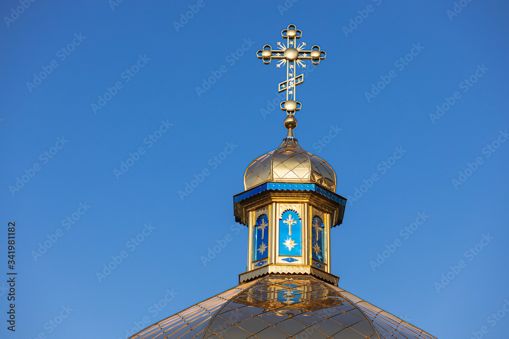 Golden dome of the church against the blue sky, church cross, Christianity, faith in God