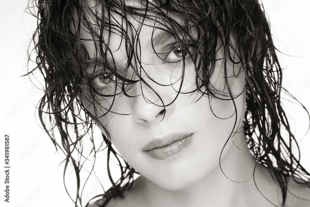 Close-up duotone portrait of beautiful woman with wet hair