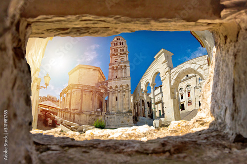 Ancien old Roman queen Jelena square and cathedral in Split view through stone window photo