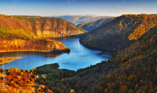 Picturesque Dniester River. Autumn sunset over river canyon