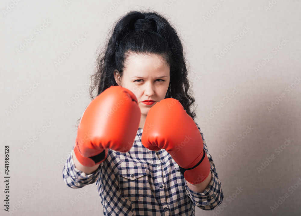 businesswoman with boxing gloves ready for fighting businesswoman with boxing gloves ready for fighting