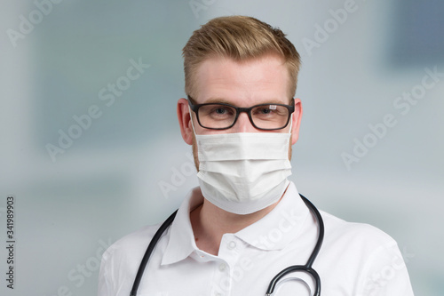 portrait of a doctor with medical face mask and stethoscope