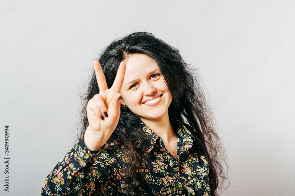 girl showing two fingers girl showing two fingers