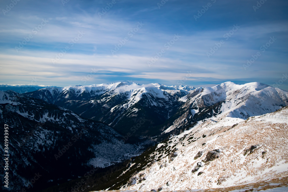 Views from the top of Kasprowy Wierch on a winter sunny day with snow