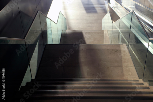 Airport interior, windows, stairs lights and shadows