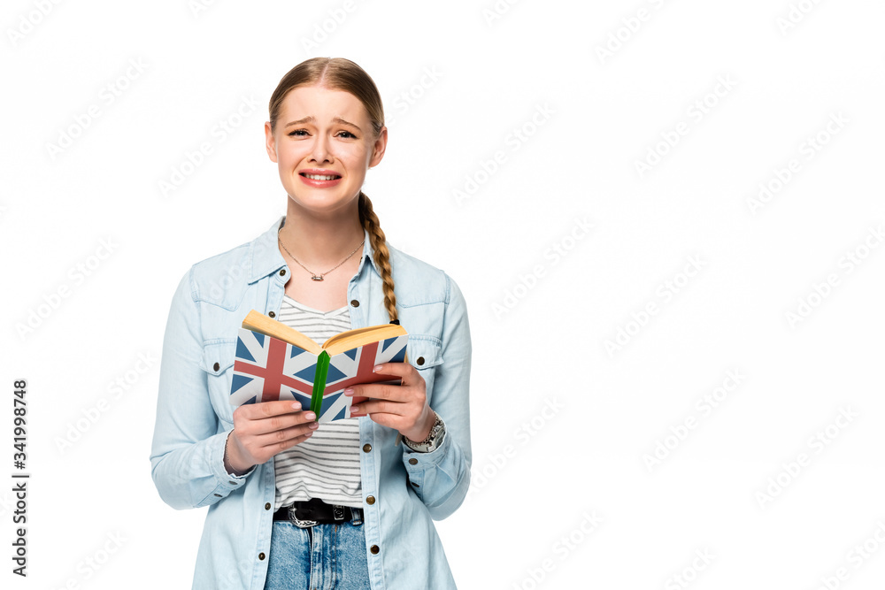 sad pretty girl with braid reading book with uk flag isolated on white sad pretty girl with braid reading book with uk flag isolated on white