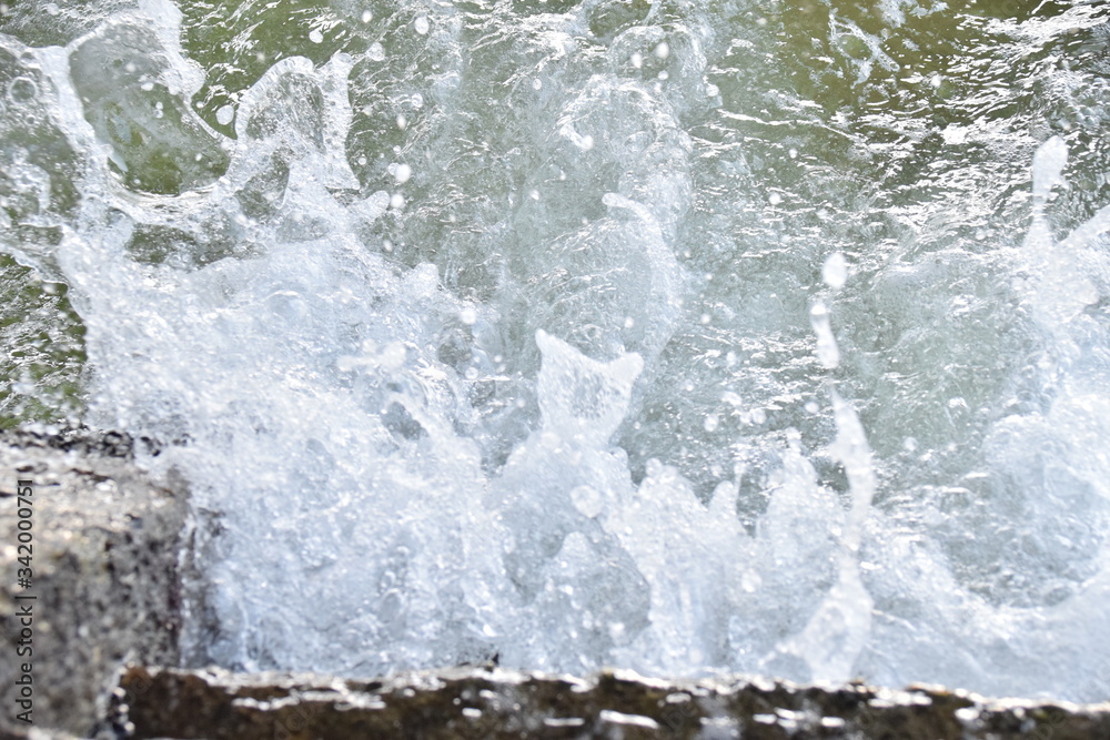 water flowing over rocks water flowing over rocks