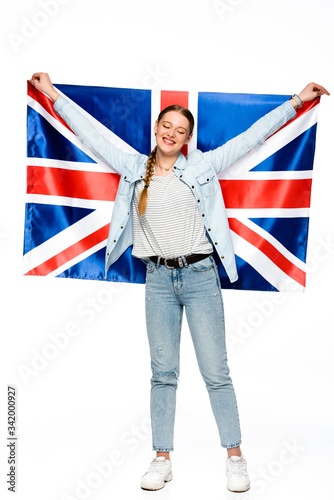 happy pretty girl with braid holding uk flag isolated on white