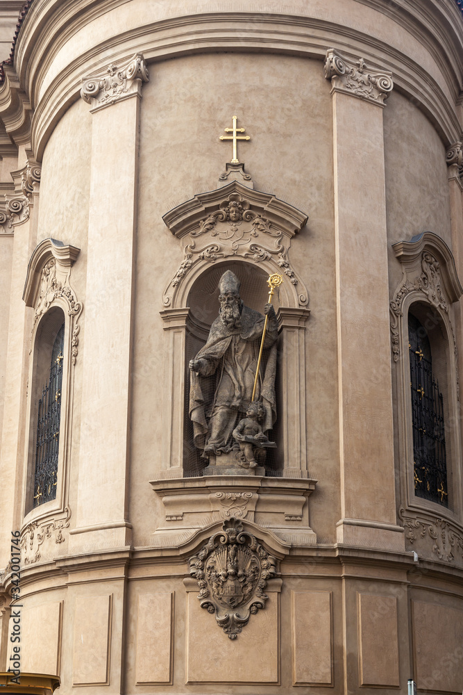 Sculpture of a biblical saint with a Christian cross