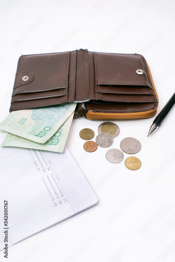 Thai banknote 40 baht and coins in old wallet, Financial problems, no money in the account book, Spend economically due to the domestic economic crisis. Thai banknote 40 baht and coins in old wallet, Financial problems, no money in the account book, Spend economically due to the domestic economic crisis.