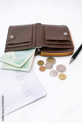 Thai banknote 40 baht and coins in old wallet, Financial problems, no money in the account book, Spend economically due to the domestic economic crisis. 