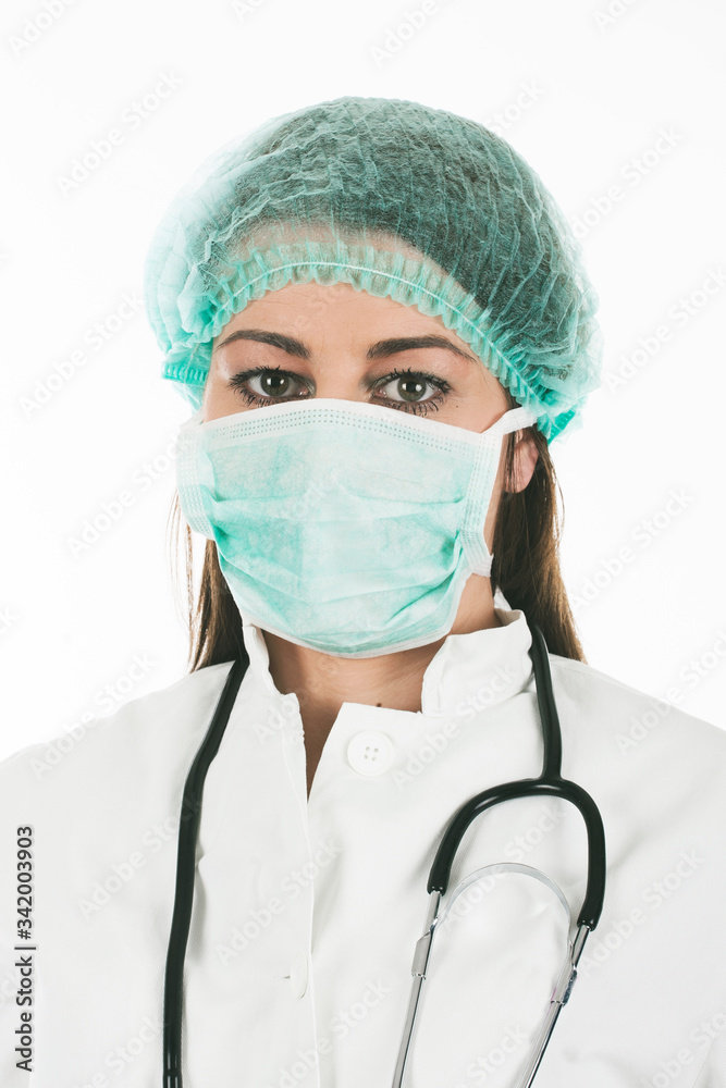 Woman doctor wearing a medical protective mask against coronavirus