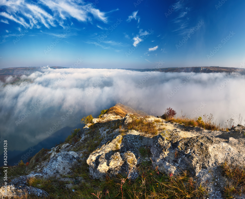 rocks in the fog. autumn fog on the canyon of the Dniester River