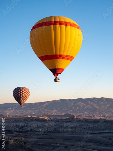 March 2020: Hot air balloon flying over spectacular Cappadocia, Turkey © ikmerc