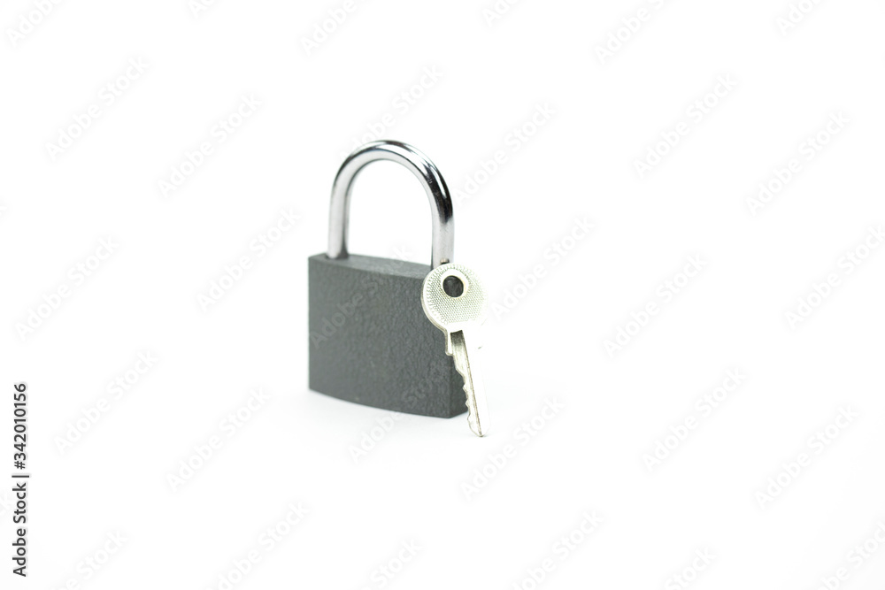Locked padlock and key - symbol of security, personal data protection isolated on white background. Security concept, private information protection copy space Locked padlock and key - symbol of security, personal data protection isolated on white background. Security concept, private information protection copy space