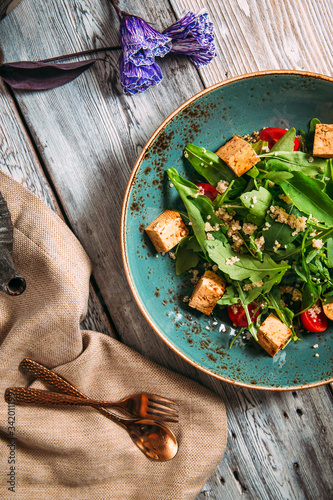 Healthy appetizing tofu salad with vegetables