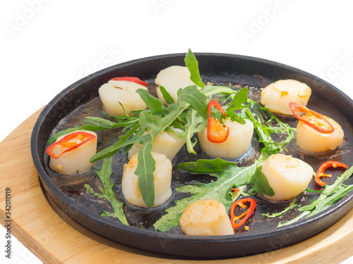 scallops on a black plate