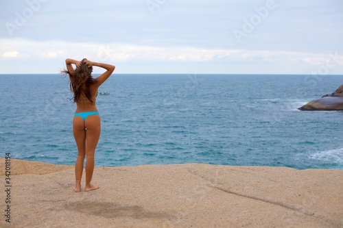 Beautiful sensual woman looking at the beach. Florianópolis, Brazil