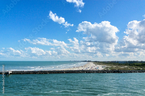 Cape Canaveral, Florida/USA - Apr 23, 2016: Sandy landform, that leads to Cocoa Beach in Port Canaveral. Travel ocean picture. photo